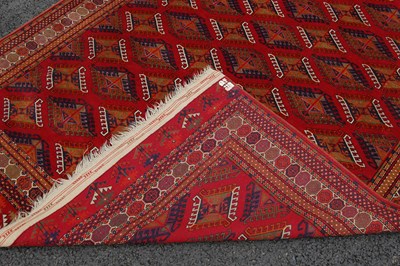 Lot 821 - A 20th century Tekke type rug, the madder...