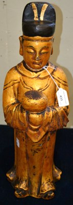 Lot 433 - A Chinese carved and lacquered giltwood figure...
