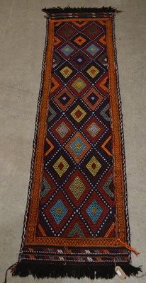 Lot 752 - An old Suzni runner, the madder ground...