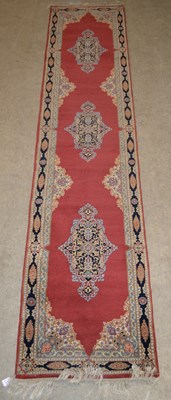 Lot 755 - A vintage Persian runner, the rectangular...