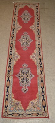Lot 760 - A vintage Persian runner, the madder coloured...
