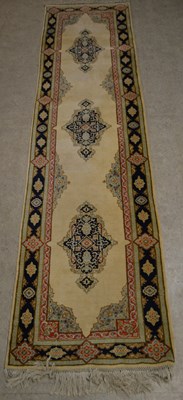 Lot 763 - A vintage Persian runner, the ivory coloured...