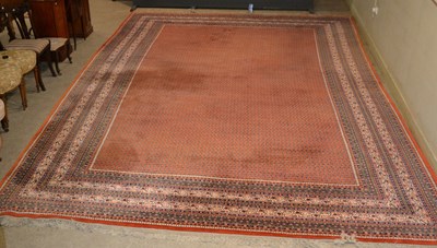 Lot 765 - A large vintage Persian Sarouk carpet/ rug,...