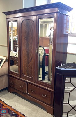 Lot 642 - A late 19th century mahogany triple door...