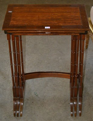 Lot 1076 - An early 20th century mahogany nest of three...