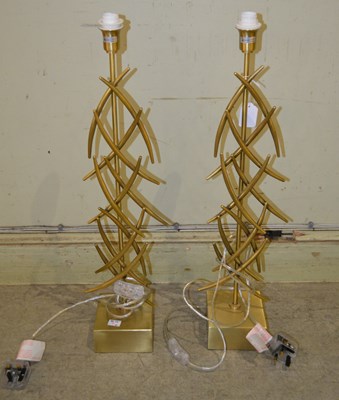 Lot 1050 - A pair of contemporary branch like brass table...