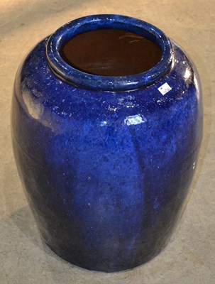Lot 1080 - A blue glazed pottery jar of lobbed form, 50cm...