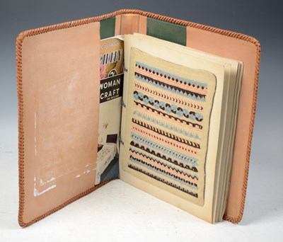 Lot 863 - A vintage embroidery sampler book, or "Stitch...