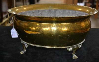 Lot 800 - A 19th century brass wine cooler of oval form...