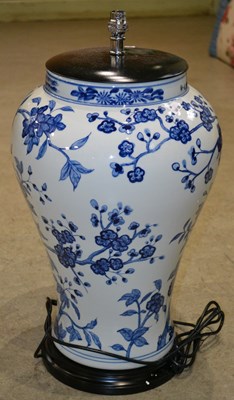 Lot 1089 - A large blue and white ceramic lamp of lobbed...