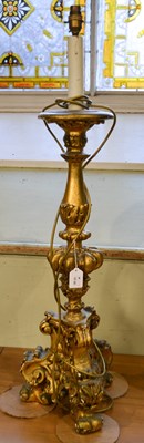 Lot 1128 - A Baroque style gilt wood candle stick...