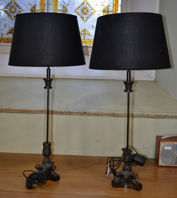 Lot 1105 - A pair large table lamps featuring a bronze...