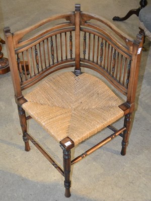 Lot 1082 - An Arts & Crafts style corner chair with...