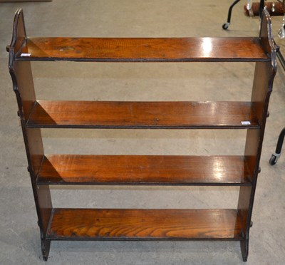 Lot 1075 - An Arts & Crafts style open bookcase with four...