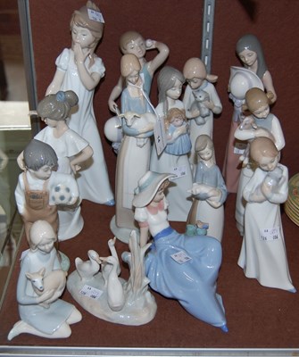 Lot 14 - A group of fourteen Lladro, Nao and other...