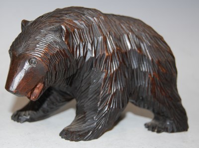 Lot 28 - A Black Forest carved wood figure of a bear,...