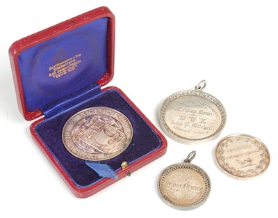 Lot 72 - Four Scottish silver school prize medals,...