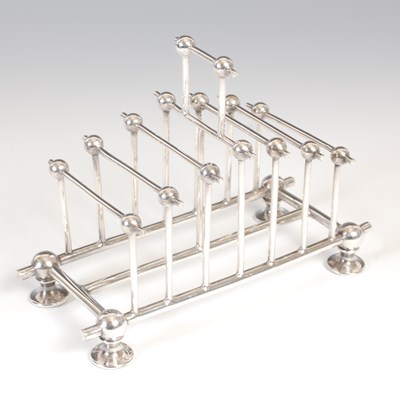 Lot 81 - A late 19th century silver-plated toast rack,...