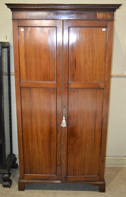 Lot 1040 - An Edwardian mahogany wardrobe / hall cupboard,...