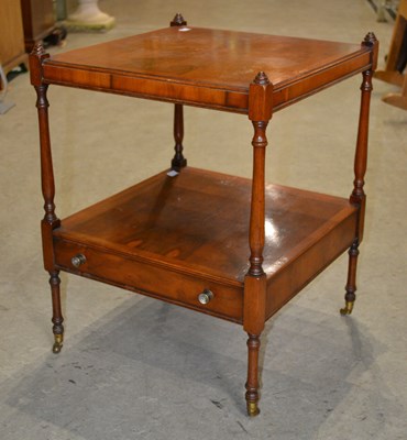Lot 1053 - A reproduction two-tier occasional table with...