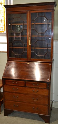 Lot 1054 - An Edwardian mahogany bureau bookcase, with...