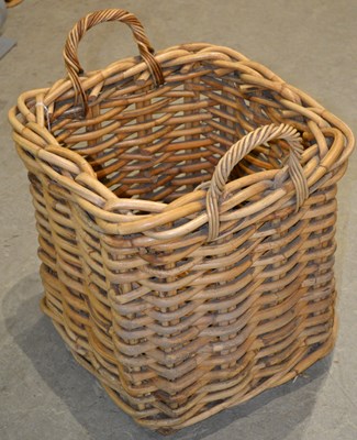 Lot 1058 - A rattan log basket of squared form, with two...