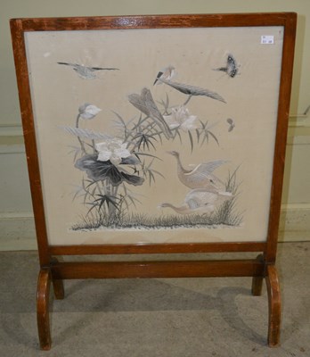 Lot 1059 - An early 20th century fire screen, featuring a...