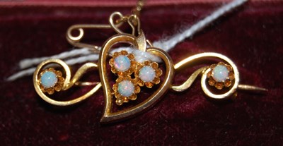 Lot 34 - A 15ct gold and five stone opal set...