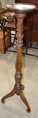 Lot 1094 - A 20th century mahogany torchere plant stand,...