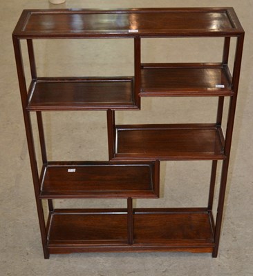 Lot 1108 - A 20th century Chinese hardwood open display...
