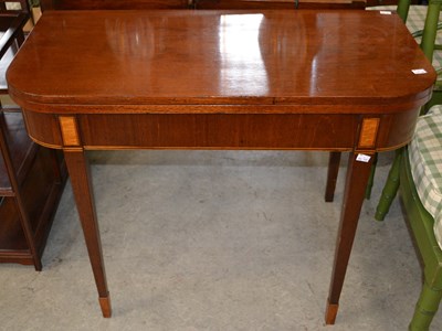 Lot 1109 - A 19th century mahogany fold-over tea table /...