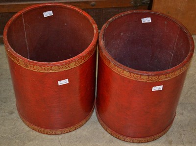 Lot 1111 - A pair of cylindrical red leather waste...
