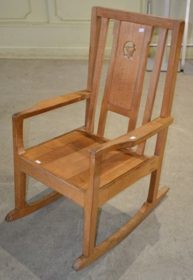 Lot 1095 - A 20th century Wren Man oak rocking chair,...