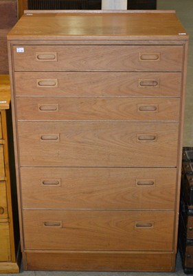 Lot 1127 - A 20th century teak chest of six drawers by...