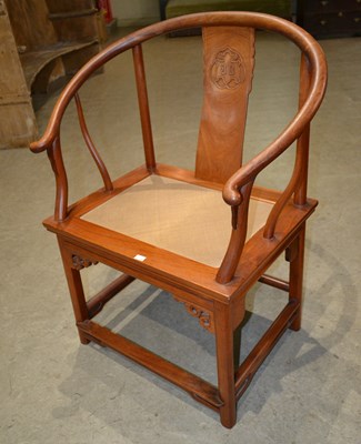 Lot 1130 - A 20th century Chinese horseshoe back armchair,...