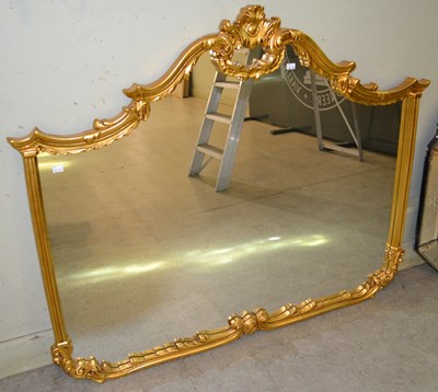 Lot 1032 - A large reproduction overmantle mirror in the...