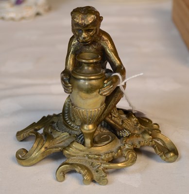 Lot 768 - A brass monkey inkwell, the seated monkey...