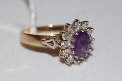 Lot 43 - A 9ct gold, amethyst and diamond chip flower...