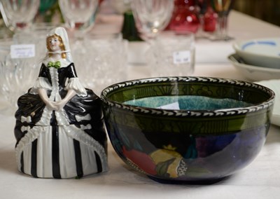 Lot 742 - A ceramic female figurine trinket box, the...