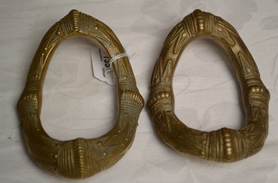 Lot 735 - A pair of West African brass manillas,...