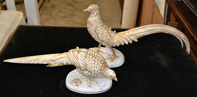 Lot 793 - A porcelain pheasant figurine, depicted...
