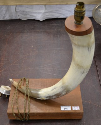 Lot 816 - A 20th century horn table lamp, raised on a...