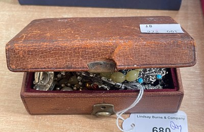 Lot 680 - A small leather style box containing assorted...