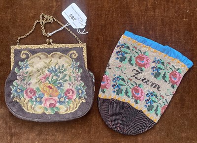 Lot 682 - A vintage embroidered purse, with metal carry...