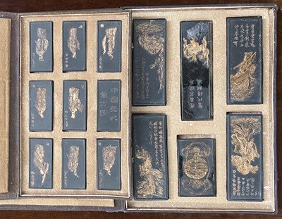 Lot 683 - Two albums containing Chinese ink sticks, the...