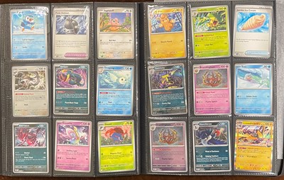 Lot 705 - An album containing Pokemon game trading cards,...