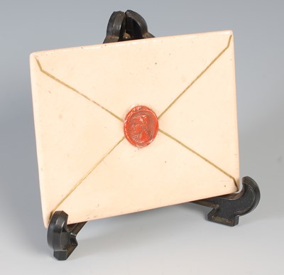 Lot 667 - A 20th century ceramic envelope, featuring...