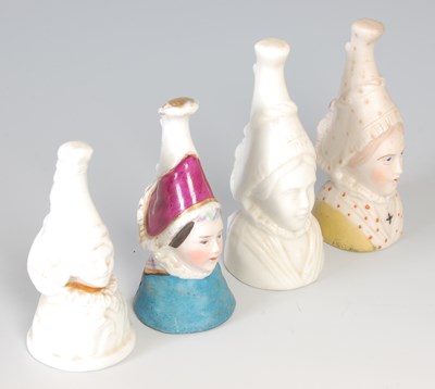 Lot 672 - A group of four ceramic candle snuffs in the...