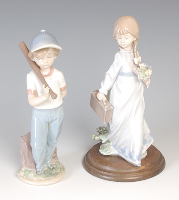 Lot 673 - A Lladro porcelain figurine of a young boy,...