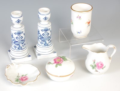 Lot 651 - A pair of Meissen onion candlesticks,...